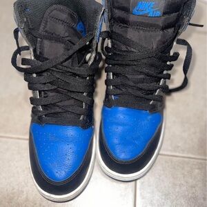 Nike Blue and Black Sneakers with High-Top Design and Lacing System